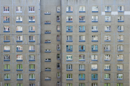 Facade of a multi-storey panel building. Fragment of wall of house. Typical block of flats in Russiaの写真素材