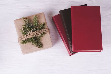 gift box and old books on a white wooden background. Christmas & New Year leisure  conceptの写真素材