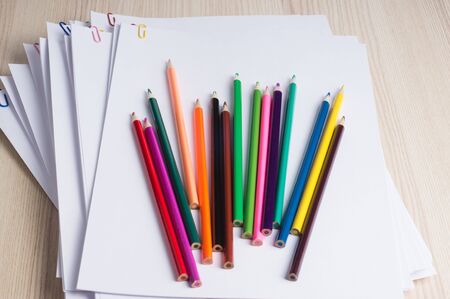 Stack of white papers with paper clips on office table