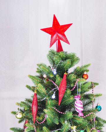 Christmas decorations and toys on artificial spruce, New Year atmosphere.の写真素材