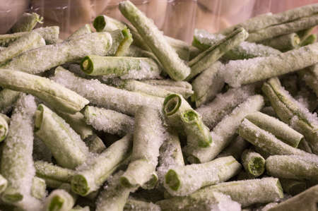 close-up frozen vegetables - chopped beans from the refrigerator.