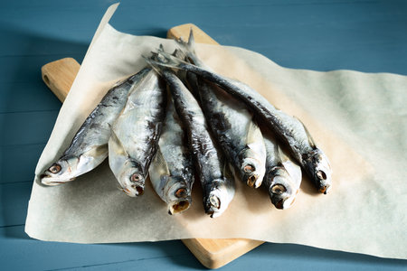 background, blue, closeup, cuisine, dried, fish, fishing, food, ipiatnye, natural, nautical wooden, packaging, paper, river, rope, salty, sea, traditionalの写真素材