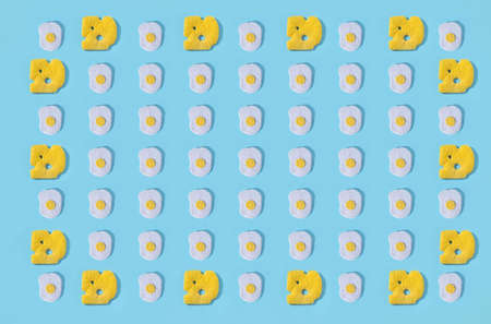 Toys in the form of food hand made of felt on blue background. hand sewing. Minimal artistic food...