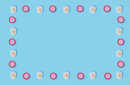 Toys in the form of food hand made of felt on blue background. hand sewing. Minimal artistic food...