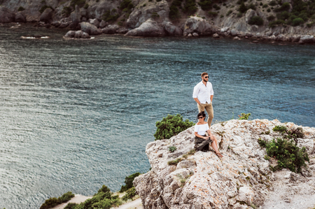 A couple in love travels. Boy and girl at the sea. Travelers. Man and woman have a rest abroad. The relationship between man and woman. Honeymoon trip. Newlyweds on their honeymoonの写真素材