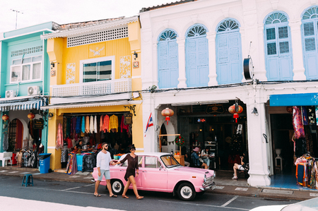 Colored streets of the city A couple in love travels. Man and woman in Asia. The couple is traveling by carのeditorial素材