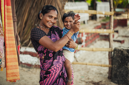 Unidentified Indian women are smiling with very good mood. A mother and her child.のeditorial素材