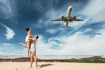Beautiful couple on having fun on the Mai Khao Beachの写真素材