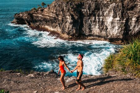 A couple in love is vacationing on the island of Bali. Man and woman on the island. Sea tour. Honeymoon trip. Couple on a honeymoon. A beautiful couple travels the world. Happy couple on vacation.の写真素材