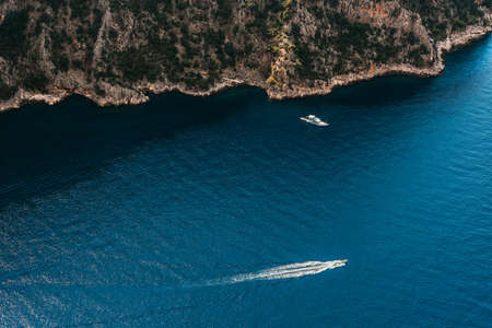 Summer landscape with sea and mountain range. Sea aerial view. Blue mountains and blue sea. Landscapes of Turkey city of Marmaris. Aerial view of a paradise sea with clear water. Copy spaceの写真素材
