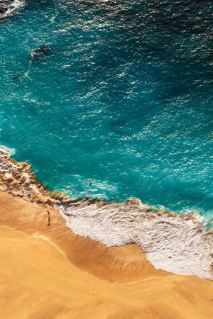 Beautiful coast on the islands in the Indian Ocean, vertical view. Beautiful sandy beach with turquoise sea. Top view of a tropical turquoise ocean beach. Coast as a background from top view. Maldivesの写真素材