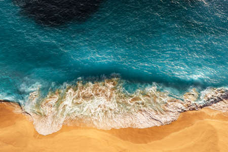 Relaxing aerial beach scene, summer vacation holiday template banner. Waves surf with amazing blue ocean lagoon, sea shore, coastline. Perfect aerial drone top view. Peaceful bright beach, seasideの写真素材