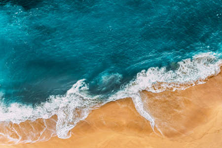Relaxing aerial beach scene, summer vacation holiday template banner. Waves surf with amazing blue ocean lagoon, sea shore, coastline. Perfect aerial drone top view. Peaceful bright beach, seasideの写真素材