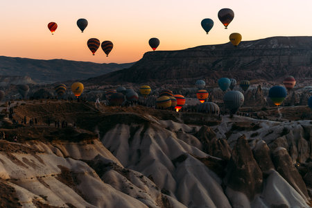 Early morning in Cappadocia, the flight of balloons. A large number of flying balloons in Cappadocia, Turkey. Flying on balloons. Festival of balloons. Copy spaceの写真素材