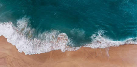 Relaxing aerial beach scene, summer vacation holiday template banner. Waves surf with amazing blue ocean lagoon, sea shore, coastline. Perfect aerial drone top view. Peaceful bright beach, seasideの写真素材