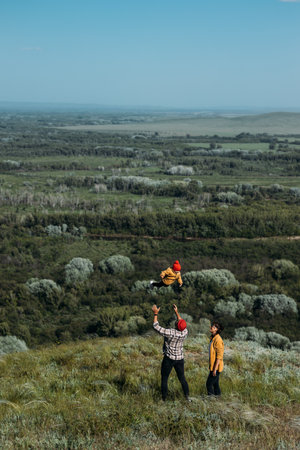 A happy family in the background of nature. Happy family together group portrait on beautiful nature...