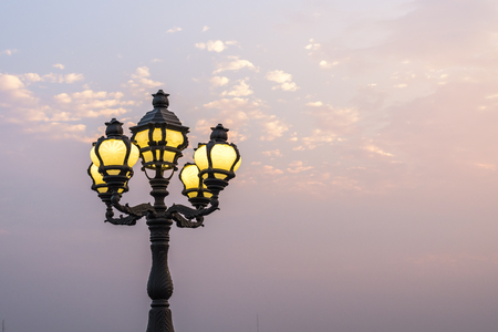 Field lighting with orange skyの写真素材