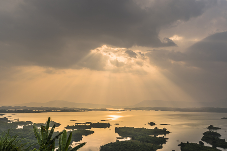 Beautiful sunset wit amazing light over the lakeの写真素材