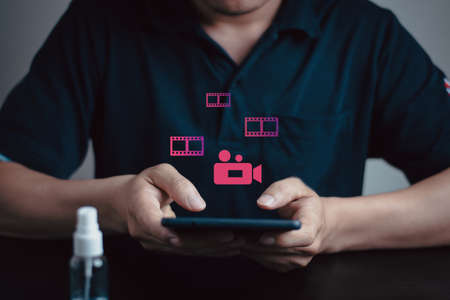 A man hand push the gel alcohol for cleaning and protech virus covid 19, Office staff routine wash hand concept, health care concept with copyspaceの写真素材