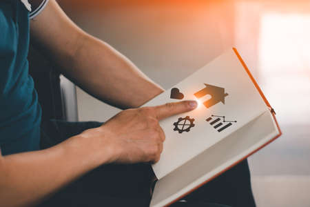 Hand and book planing, Education and business related concept, copy space for individual text and designの写真素材