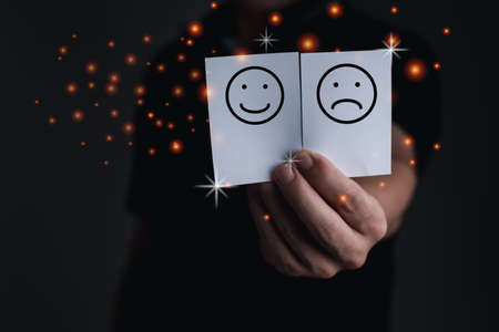 The business man hand holding the white paper with choice icon, computer graphic light, idea and...