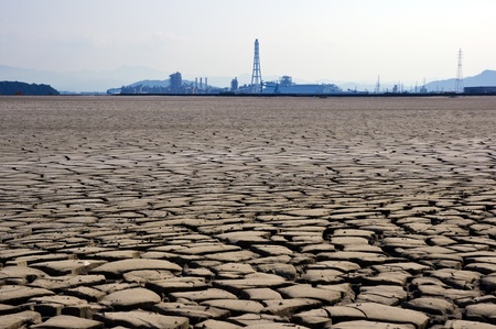 The dry earth and factory の写真素材