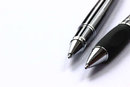 two black pens on a white backgroundの写真素材