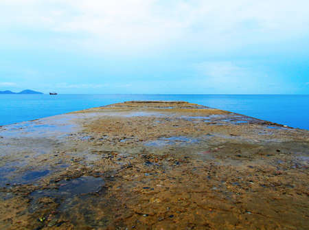 Flooded stone sinking into the seaの写真素材