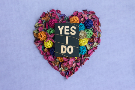 Yes I Do text on heart shaped dry petals.の写真素材