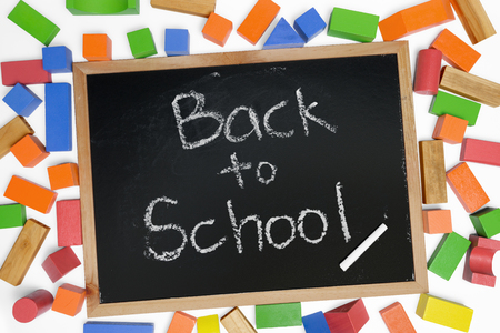 Back to School phrase on blackboard surrounded by wood blocks toy.の写真素材
