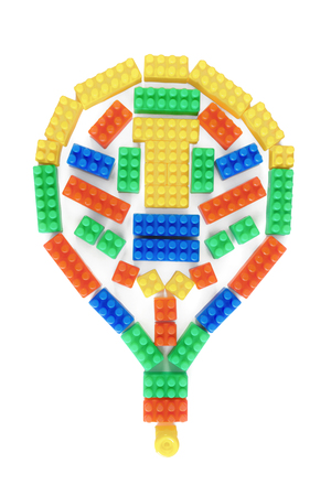 Light bulb shape with colorful plastic brick toys isolated on white background.の写真素材