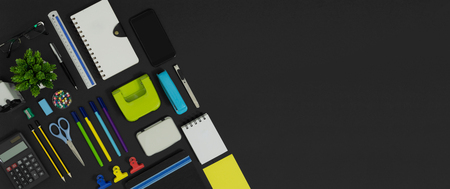 Multiple stationery items and devices for office and school. Top view flat lay of office supply with copy space.の写真素材