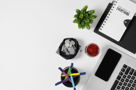 Office supplies on white office desk. Minimal simplicity flat lay with copy space.の写真素材