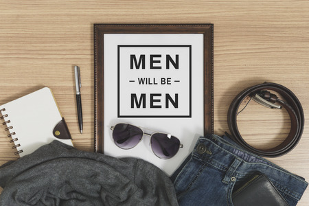 Wood frame with copy space and men's casual outfits and accessories. Fashion flat lay.の写真素材