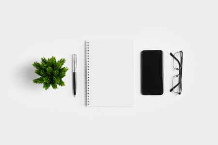 Work space from top view on white background. Minimal simplicity flat lay with copy space.の写真素材