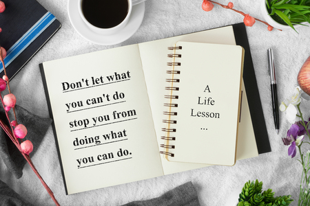 Motivational and inspirational quote. Self help quote. Notebook with pen on cozy white tablecloth with quote.Nostalgia flat lay.の写真素材