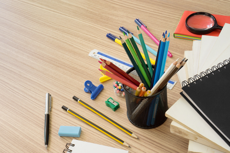 Multiple stationery items on wood background. Back to school concept.の写真素材