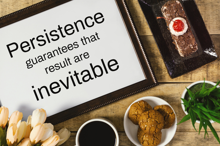 Wood frame with wisdom quote and breakfast food on rustic wood. Flat lay.の写真素材