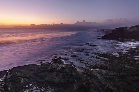 Blue hour view at Tanah Lot rocky beach, Bali Indonesia.の写真素材
