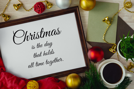 Wood frame with season's greetings wish and ornament balls decoration. Merry Christmas and holiday concepts.の写真素材