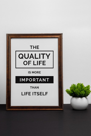 Inspirational and motivation life quote on wood frame - The Quality of Life is More Important Than Life Itself.の写真素材