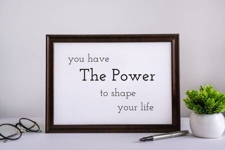 Wood Frame With Inspirational and Motivational Wisdom Quote Against White Background.の写真素材