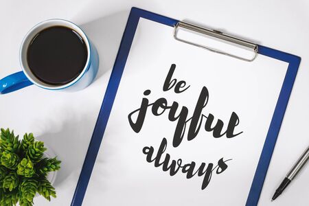 Motivational and Inspirational Quotes. Be Joyful Always. Still Life of Clipboard on Work Desk.の写真素材
