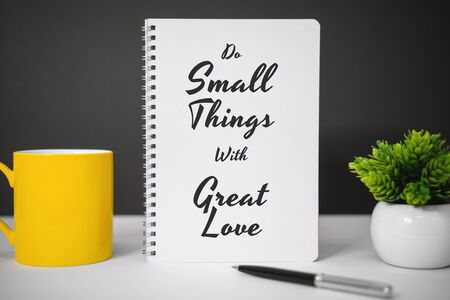 Motivational and Inspirational Quotes. Do Small Things With Great Love. Still Life of Notebook on...