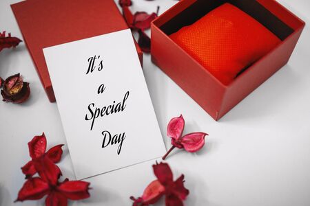 It's a Special Day. Paper Card and Gift Box with Dry Flower Petals. Love and Romance Concept.の写真素材