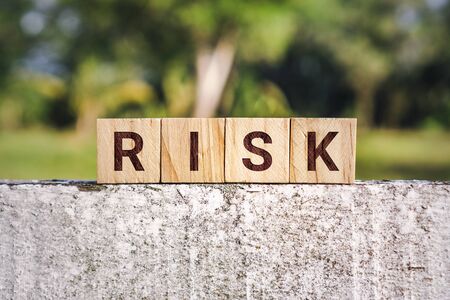 Wooden Block With The Word Riskの写真素材