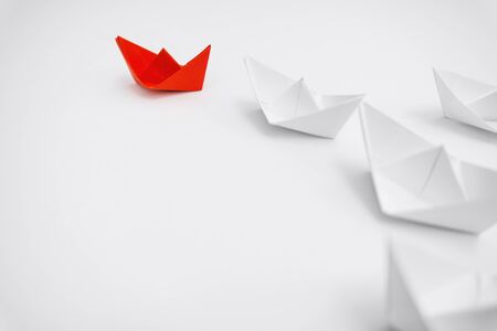 Business and Leadership. Unique Paper Boat Leading The Rest By Example.の写真素材