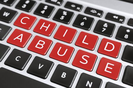 Social Issue Concept. Child Abuse Word on Computer Keyboard.の写真素材