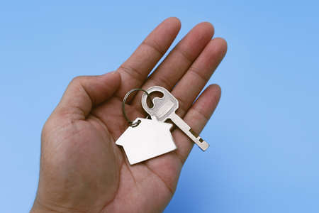 House Key in Hand. New Property and Home Ownership Concept.の写真素材