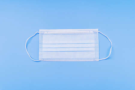 White Side of Medical Face Mask on Blue Backgroundの写真素材